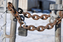 Padlocked chain link gate